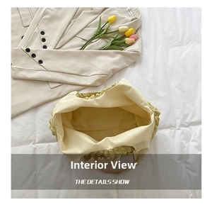 Interior view of yellow pleated tote bag showing spacious inner lining and capacity
