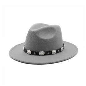 Detail view of the gray felt fedora hat with bohemian style metal studded leather band