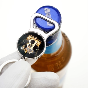 European luxury silver bottle opener keychain with golden crown and letter B emblem