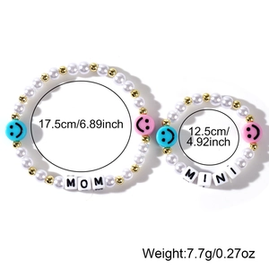 Detail view of Mom and Mini pearl bracelets with size and weight measurements info