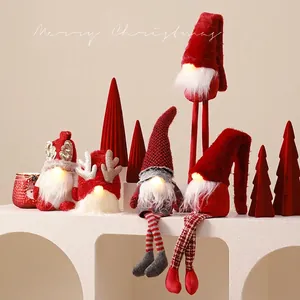 Lighted Christmas gnome plush decorations with red and grey knitting on beige background