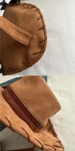 Detail of a brown suede cowboy hat bag with thick hand-stitched seams and hidden top zipper