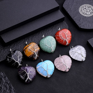 Assorted heart-shaped Tree of Life pendants with natural stones and silver wire