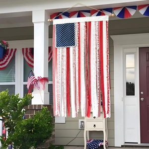 Detail of American flag porch banner with patriotic red white lace and blue star ribbon