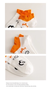 Detailed views of cotton cartoon socks featuring orange cuffs and cute face patterns