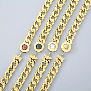 Detailed view of 13mm NK chain buckles featuring red, black, white gems and gold skull design