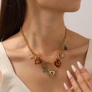 Vintage gold-plated stainless steel necklace with acrylic heart and sun charms