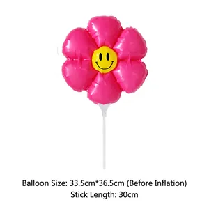 Detail of pink flower balloon with smiley face showing dimensions 33.5cm by 36.5cm