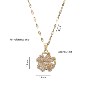Rotating four-leaf clover pendant necklace in gold finish with micro-pave white zircons