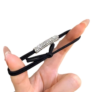 Sparkling rhinestone hair tie with black elastic cord for elegant high ponytail styling