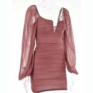 Detail view of pink-brown mesh mini dress with deep V-neck and sheer lantern sleeves