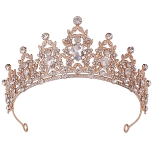 Macro detail of golden bridal tiara with sparkling crystal rhinestones and water drop gems