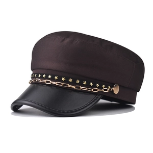 Fashionable PU leather military cap with golden chain and star details on white background