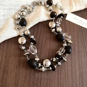 Retro double-layered necklace with silver metal beads, wood beads and crystal charms