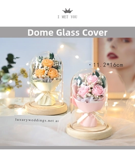 Detail of preserved roses in a glass dome with LED lights and a 11.2x16cm wooden base