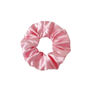 Pink satin LED glowing hair scrunchie with soft fabric texture on white background