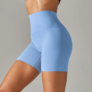 Close-up of sky blue high-waisted yoga shorts showing stretch fabric and body-shaping fit