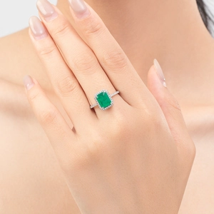 Elegant S925 sterling silver ring with emerald-cut green stone and pavé accents