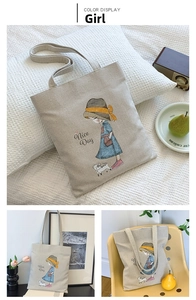 Detailed macro view of cream canvas tote bag with artistic girl print and Nice Day text