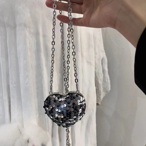 Sparkly heart-shaped sequin crossbody bag with a long silver metal chain strap
