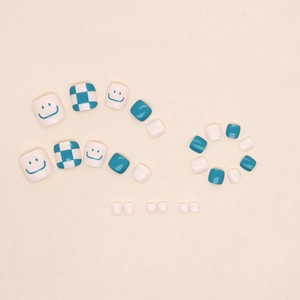 Blue and white checkerboard press-on toenails with cute smiley face patterns