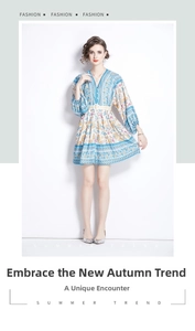 Detail of V-neck printed bohemian mini dress with lantern sleeves and woven waist belt