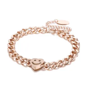 Bracelet en acier inoxydable or rose avec maille gourmette et pendentif cœur smiley