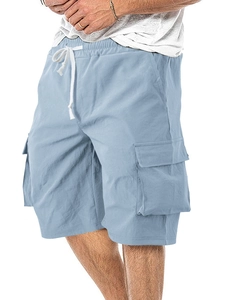 Close-up of light blue cargo shorts with elastic drawstring waist and large side pockets