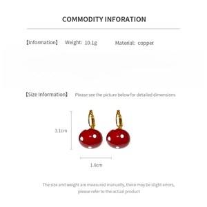 Detailed spec sheet showing 3.1cm x 1.8cm red mushroom drop earrings made of copper