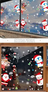Detail view of Santa, penguin and reindeer static stickers on a glass window surface