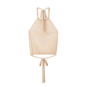 Detail of beige halter top with adjustable back ties and elastic ruffled hemline