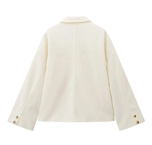 Detailed back view of a cream button-up wool jacket featuring gold cuff button accents