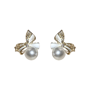 Gold bow earrings with white enamel, sparkling crystals and hanging pearls on white background