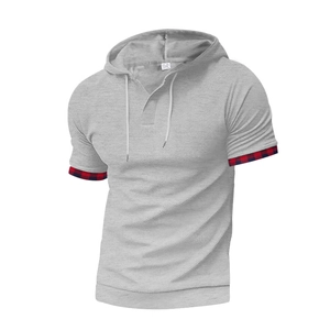 Close-up of grey hooded t-shirt featuring waffle texture and plaid pattern cuff details