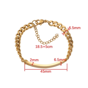 Detailed view of golden stainless steel Cuban ID link bracelet with engraved plate