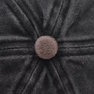 Macro detail of cotton baseball cap crown with textured fabric and top button