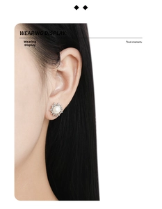 Detailed view of irregular lava style S925 silver stud earring with white natural pearl