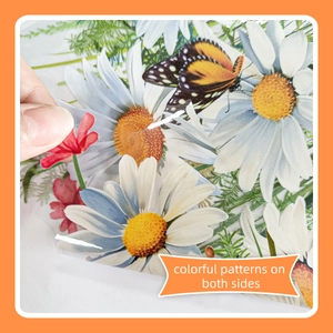 Detail of floral window sticker showing double-sided colorful daisy and butterfly patterns