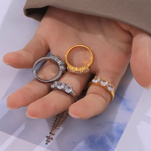 Elegant gold and silver titanium steel rings set featuring triple zircon stone settings