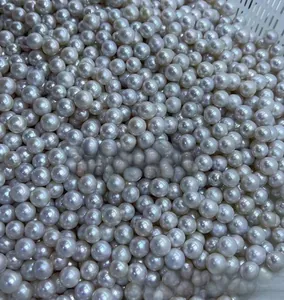 Macro shot of high-quality round white pearls with a radiant luster in a bulk display