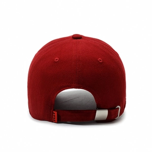 Back view of red geometric stripe baseball cap with adjustable metal buckle and hat label