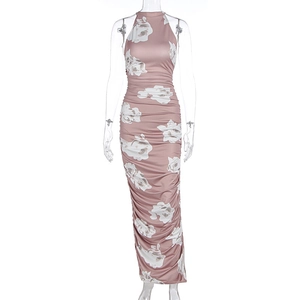 Detail of pink floral dress featuring side ruching and elegant white rose prints