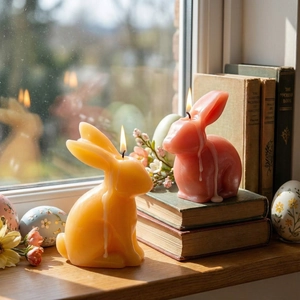 Easter bunny scented candles in yellow and coral pink with warm candle light and rustic decor