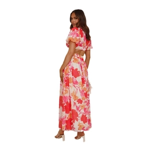 Elegant two-piece floral set with puff sleeve crop top and long maxi skirt in pink floral print
