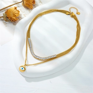 Gold titanium layered necklace with sparkling rhinestones and a round evil eye pendant