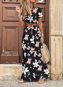 Detail of boho floral V-neck maxi dress with brown leather belt and summer straw bag
