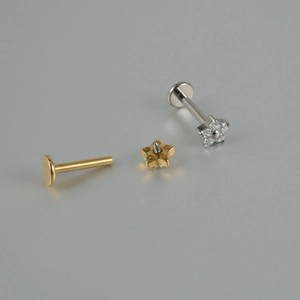 Detail view of G23 titanium labret studs with internal thread and flower zircon design