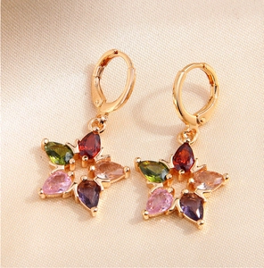 Detailed close-up of lucky star drop earrings with five colored teardrop cubic zirconia