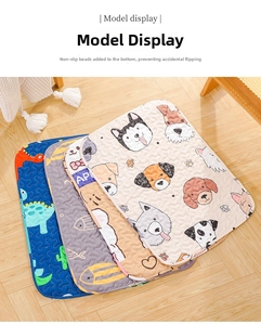 Detailed view of quilted pet mats with cartoon patterns on a cozy wooden floor background