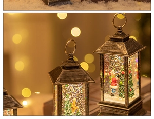Close-up of vintage Christmas lanterns with internal glitter and festive scene